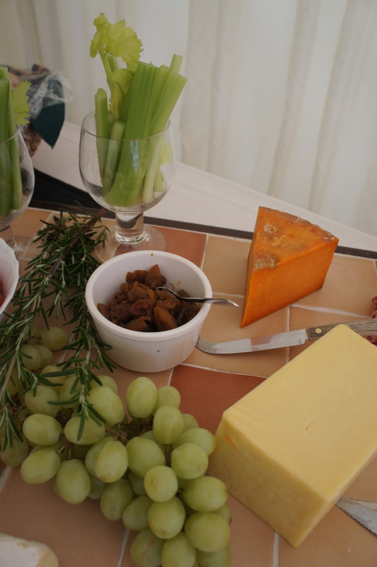 Cheeseboard with grapes, celery and chutney