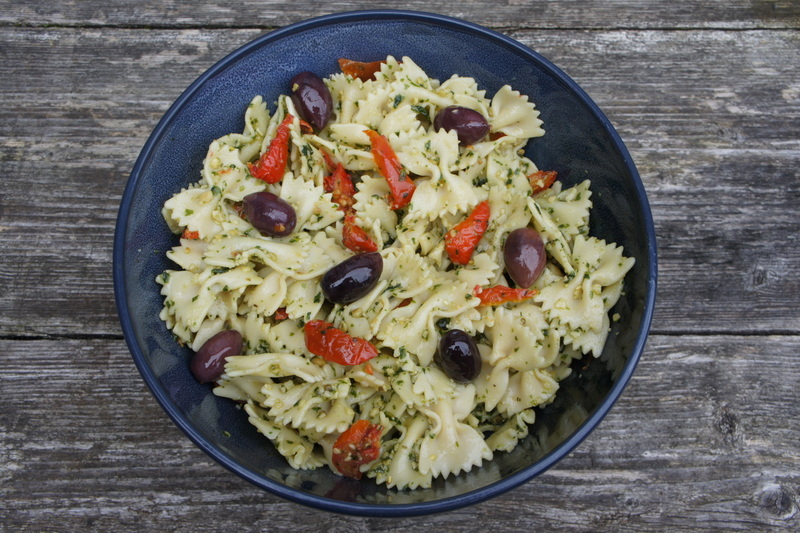 Farfale pasta salad with fresh basil pesto kalamata olive and sunblush tomatoes