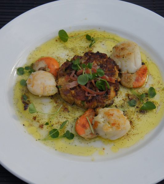 Sauteed scallops with chickpea cake and pancetta