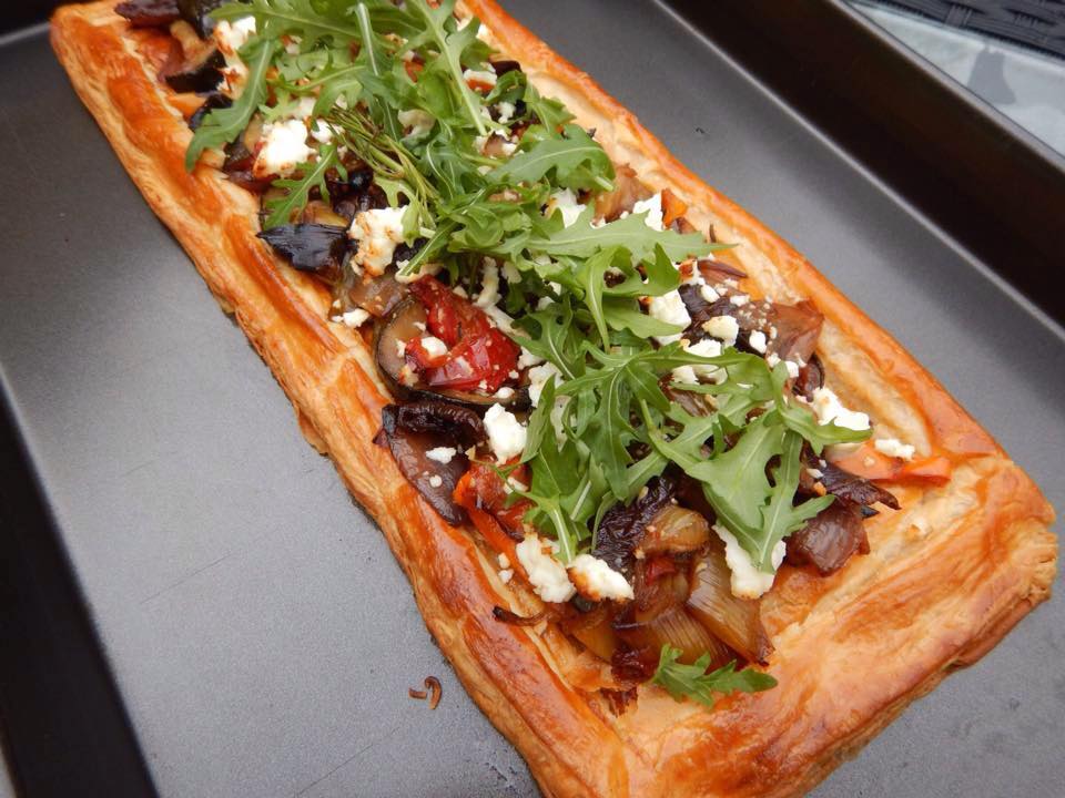 ustic pastry slice with roasted mediterranean vegetable, feta cheese and wild rocket